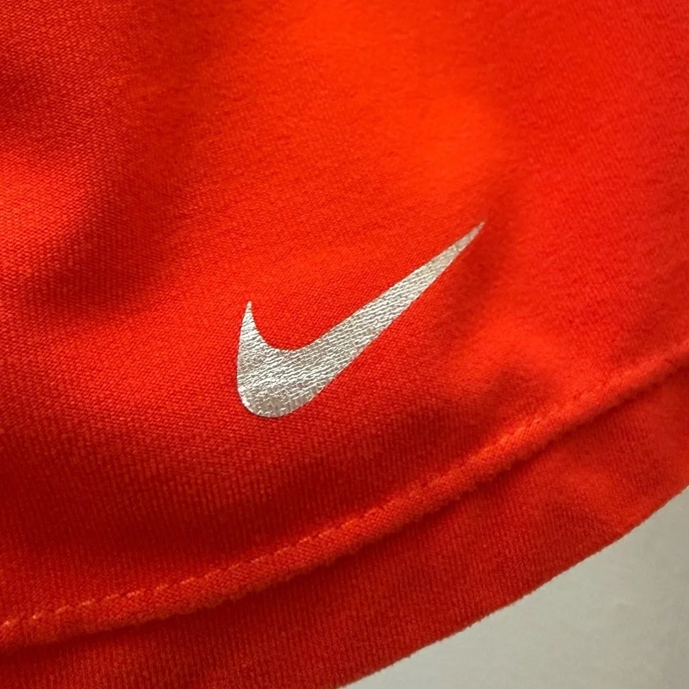Nike red athletic skort featuring built-in compression shorts Size M